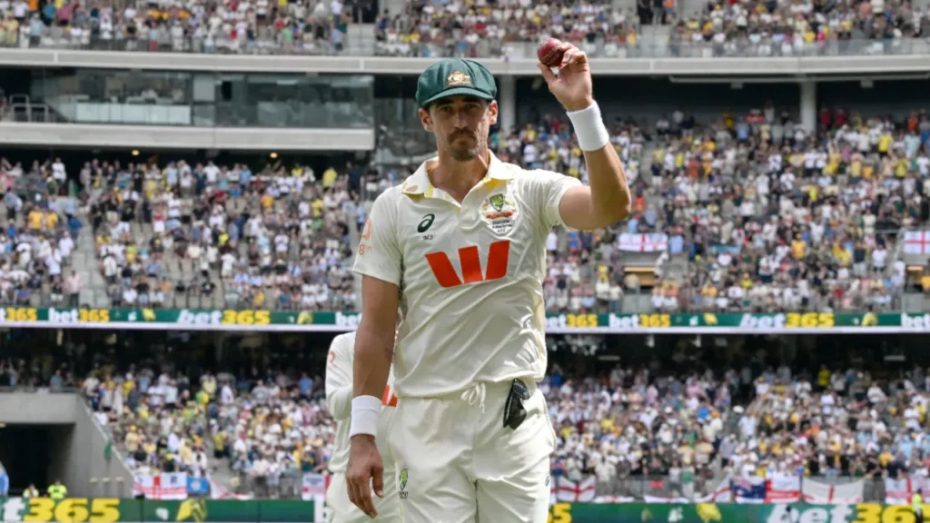 Mitchell Starc bowling with intense focus during the 2025 Ashes first Test at Optus Stadium Perth